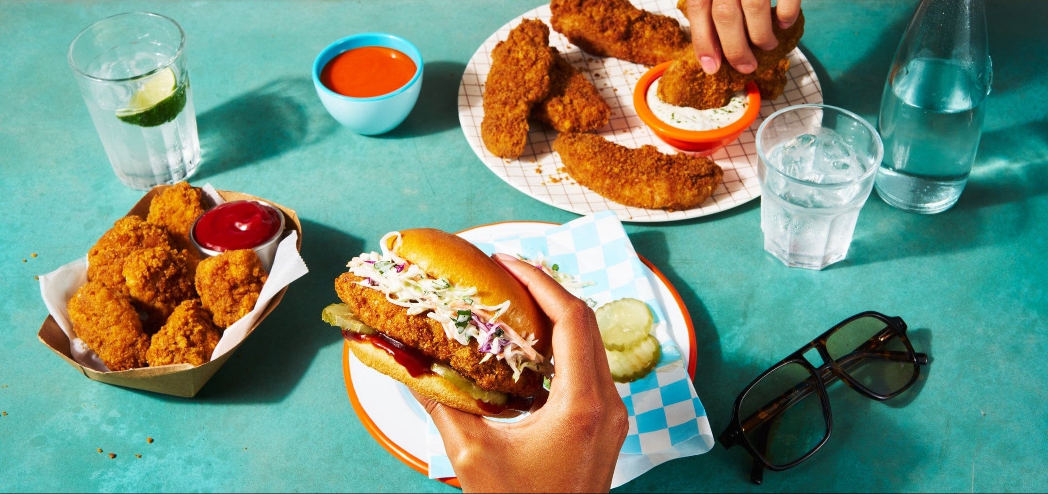 Tablescape with chicken sandwich, nuggets, and strips
