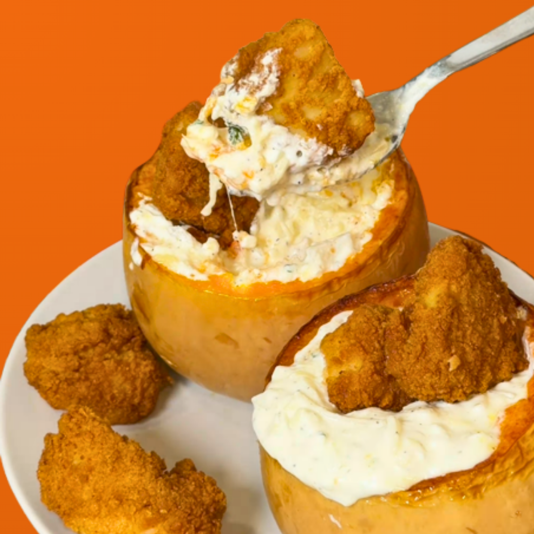 french onion dip in butternut squash topped with chicken nuggets